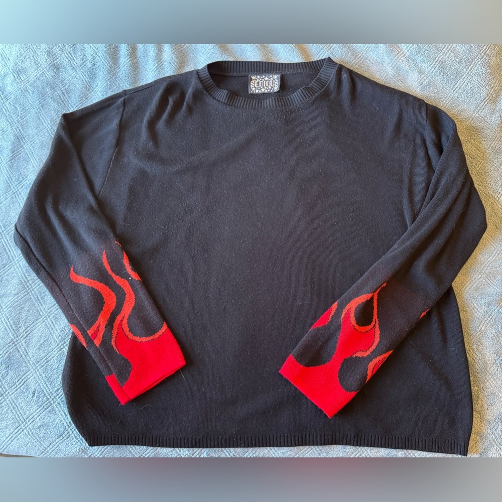 Serious Clothing XXL sweater with flame graphics on the sleeves.